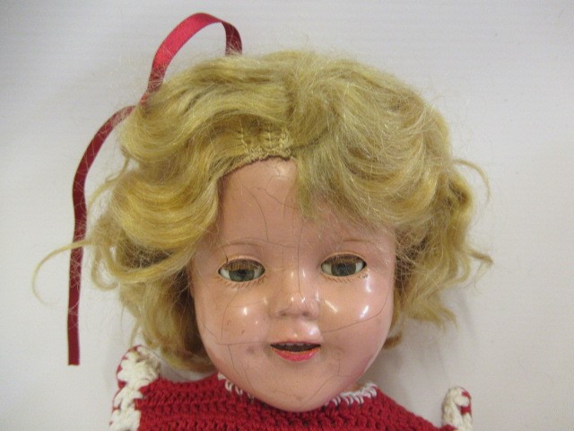 A Shirley Temple doll, with composition socket head, sleeping eyes, open mouth, blond wig, Image
