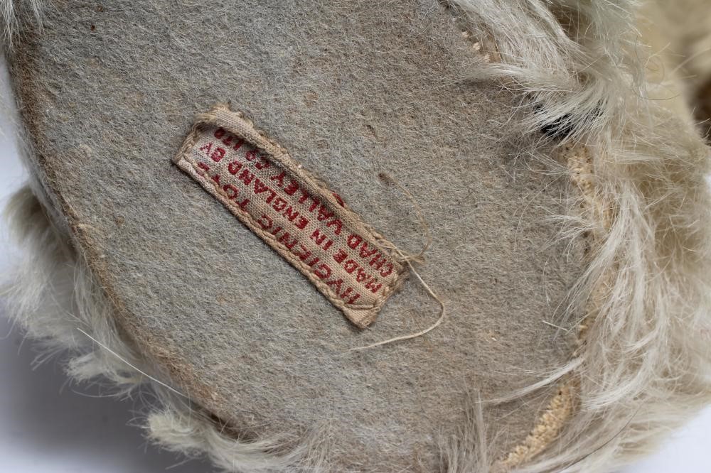 A Chad Valley teddy bear, with amber eyes, sewn nose, felt pads, light orange plush and Hygienic Image