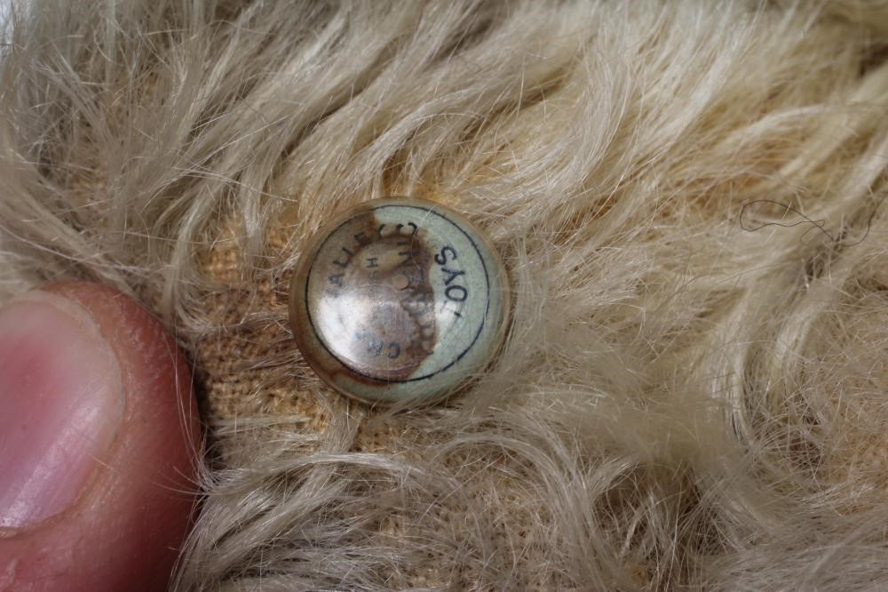 A Chad Valley teddy bear, with amber eyes, sewn nose, felt pads, light orange plush and Hygienic Image