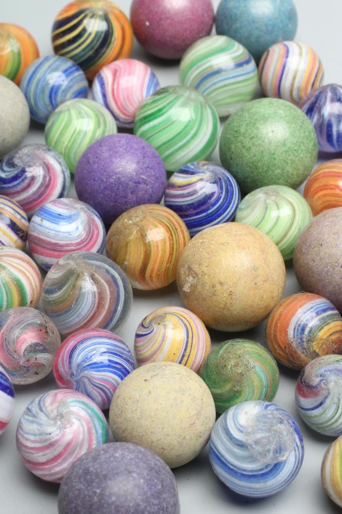 Fifty two early glass and clay marbles from 10-15mm sizes, most items in good condition (Est. plus Image