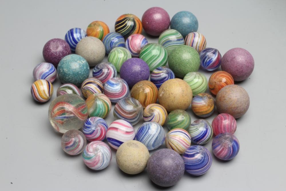 Fifty two early glass and clay marbles from 10-15mm sizes, most items in good condition (Est. plus Image