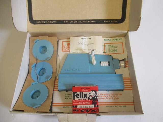 Chad Valley Disneyland Easy-Show Cine Projector with three films, boxed, G-E, and an 8mm film of Image