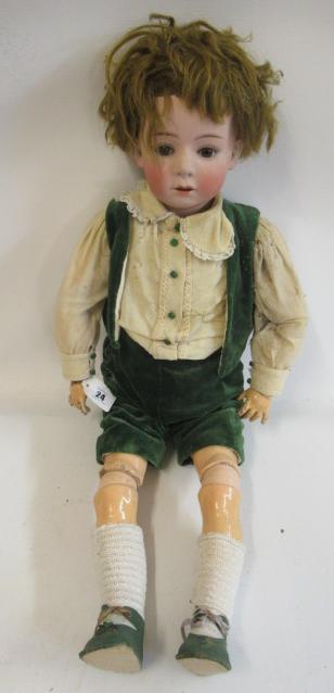 A Heubach bisque socket head boy doll Image