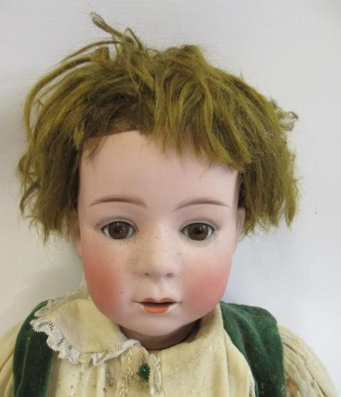 A Heubach bisque socket head boy doll Image