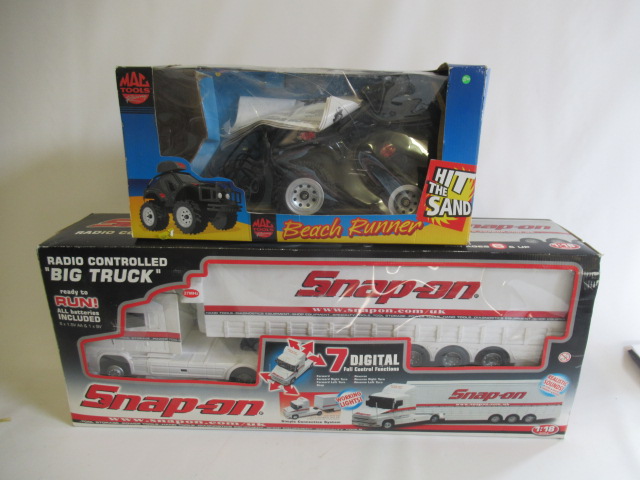 A Snap-On 1:18 scale radio controlled "Big Truck" and MAC Tools radio controlled Beach Runner, both Image