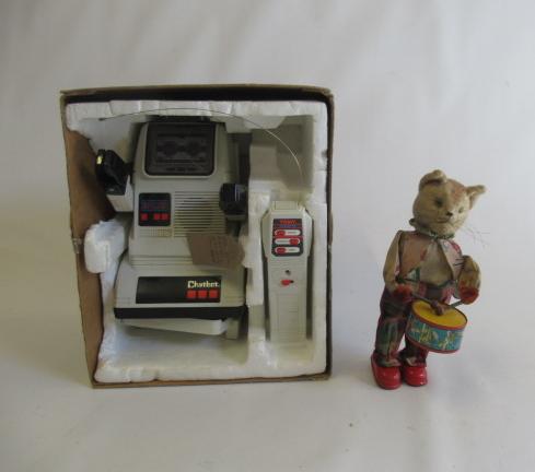 A clockwork drumming/walking cat, (clockwork motor ok) and a battery operated TOMY robot, F (Est. Image