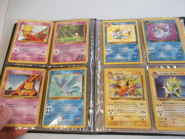 Two Pokemon card collection folders Image