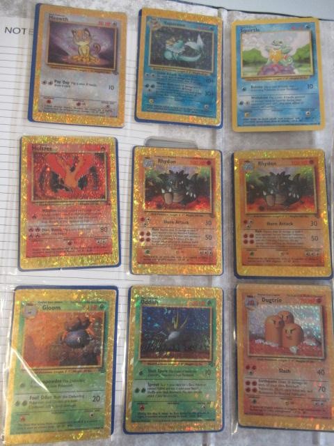 A collection of Pokemon cards, comprising 118 Pokemon and 12 trainer cards. 65 are 1999 Pokemon Image