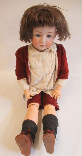 A Heubach bisque socket head boy doll Image