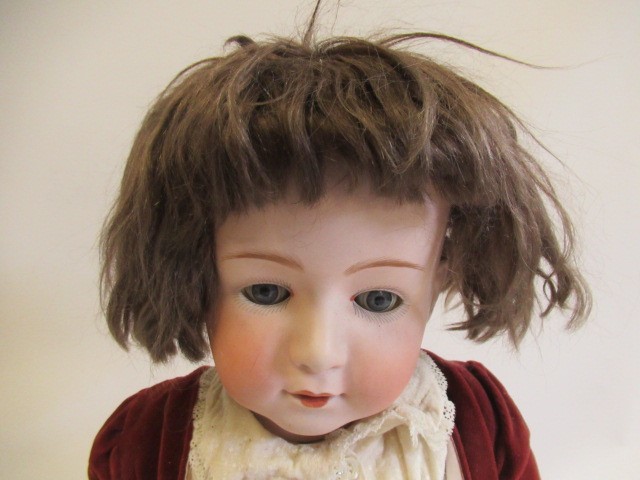 A Heubach bisque socket head boy doll Image