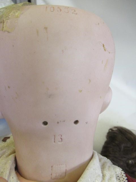 A Heubach bisque socket head boy doll Image