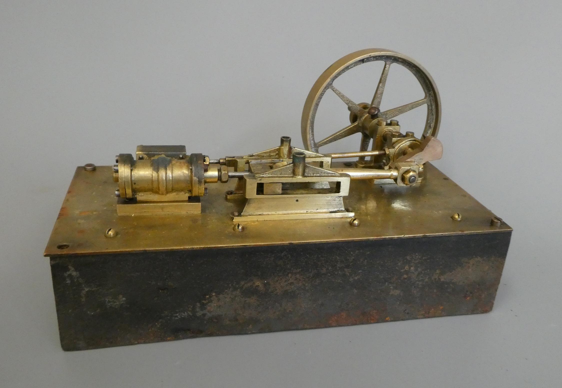 Brass stationary mill type engine on cast iron base marked Made 1890 by C. Baker, Edenbridge, Kent, Image