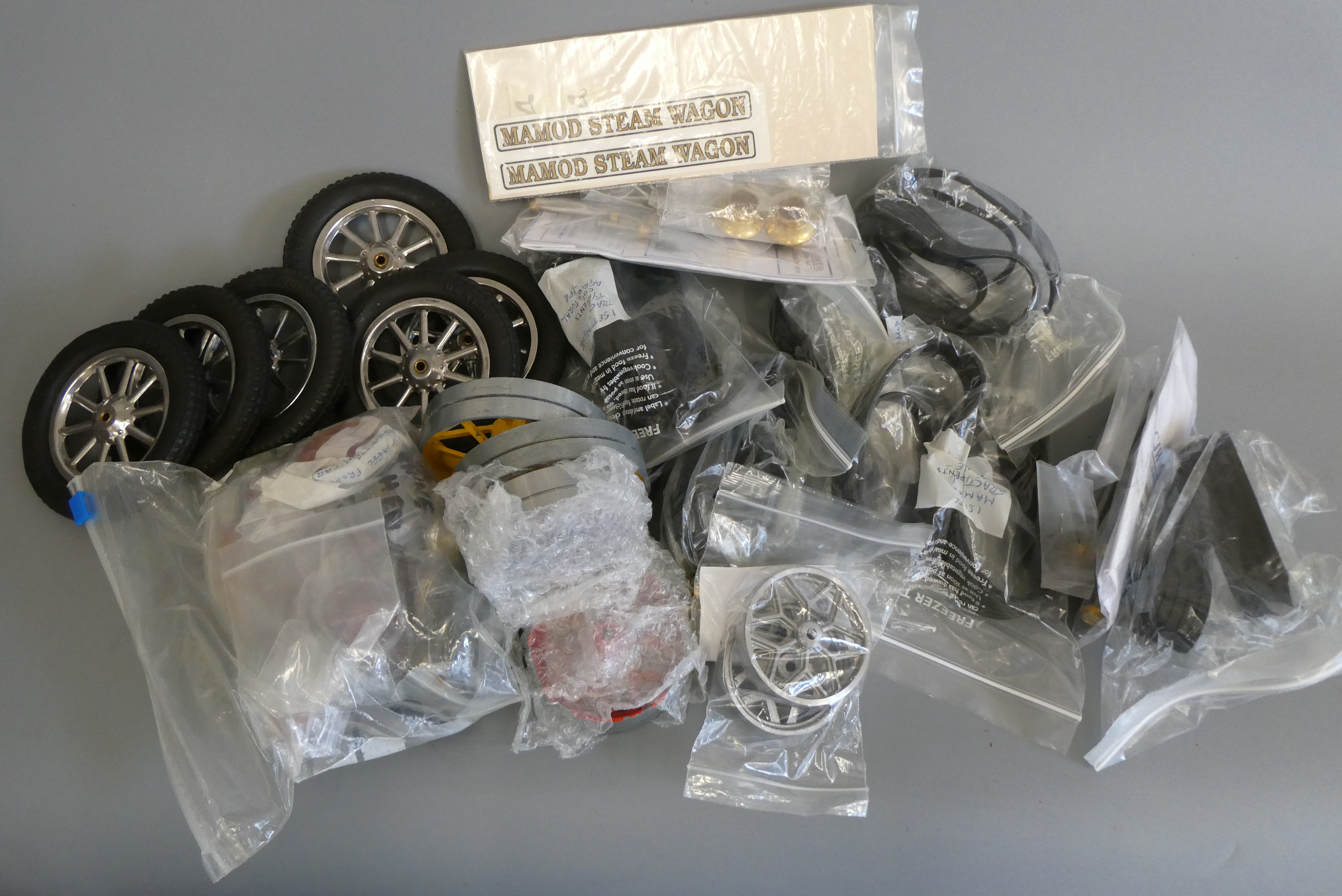 Mamod spares including wheels, axles and rubber tyres, most items in unused condition, G-E (Est. Image