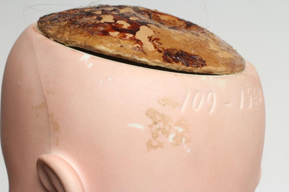 A Heinrich Handwerck bisque socket head doll Image