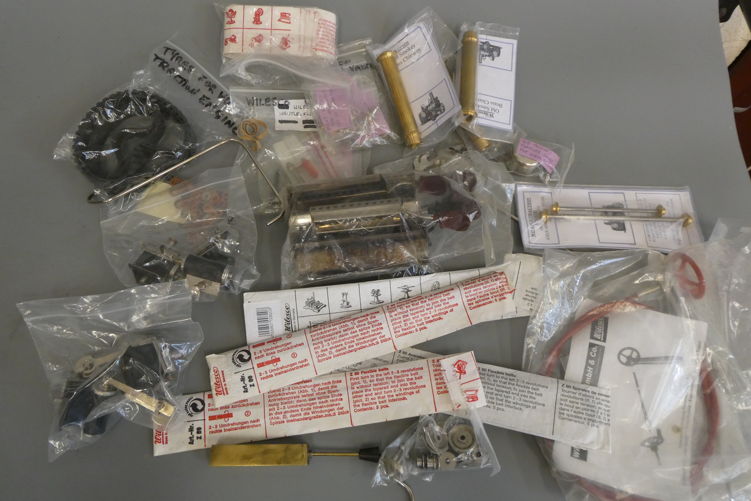 A large quantity of spare parts for Wilesco steam engines including cylinders, pipe work, tyres and Image