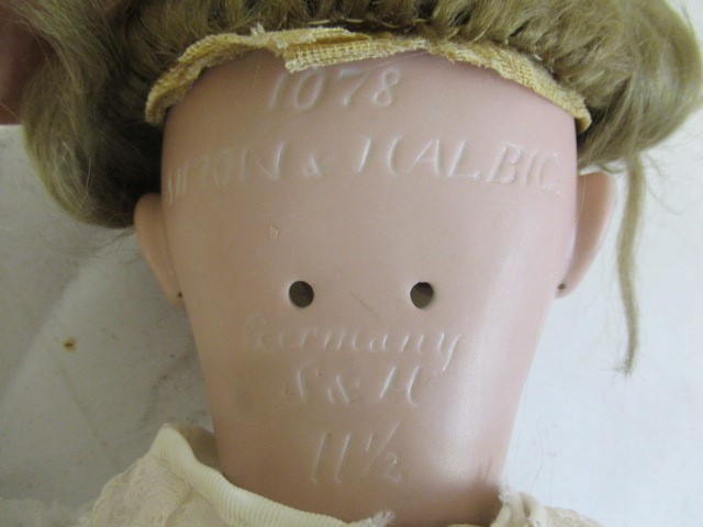 A Simon & Halbig bisque socket head doll Image