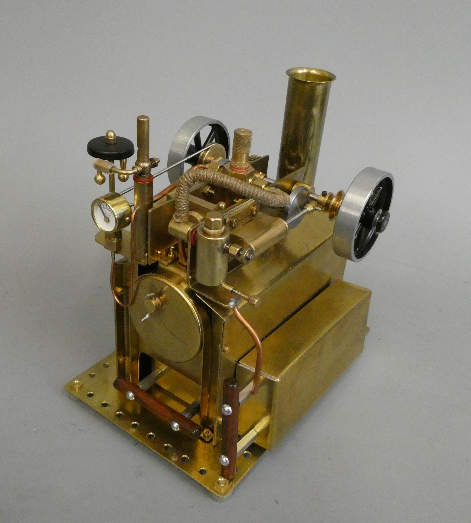 Twin cylinder over-type steam engine, spirit fired boiler with water level plug, pressure gauge, Image