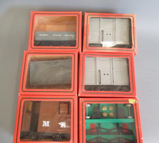 Six Mamod railway wagons comprising two open trucks, two covered vans, wagon kit and brake van, Image