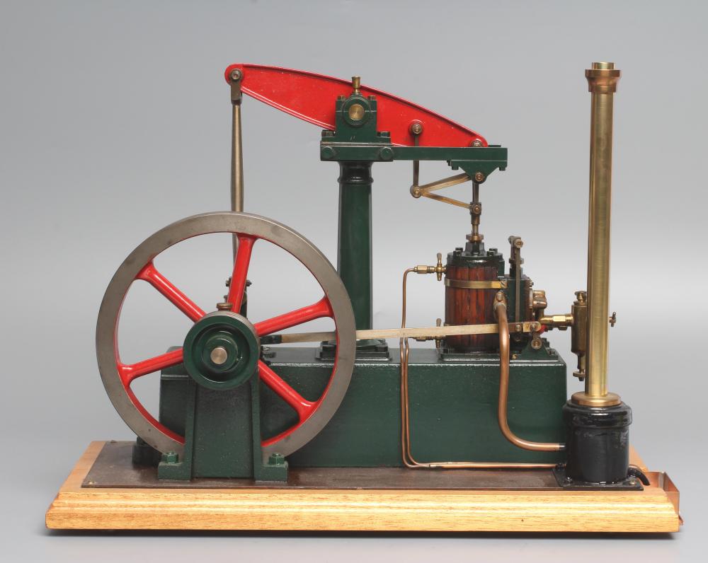 Well engineered Stuart Beam engine finished in red/green on wood base, E (Est. plus 24% premium inc. Image