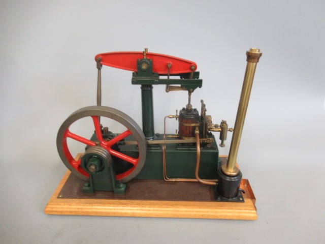 Well engineered Stuart Beam engine finished in red/green on wood base, E (Est. plus 24% premium inc. Image