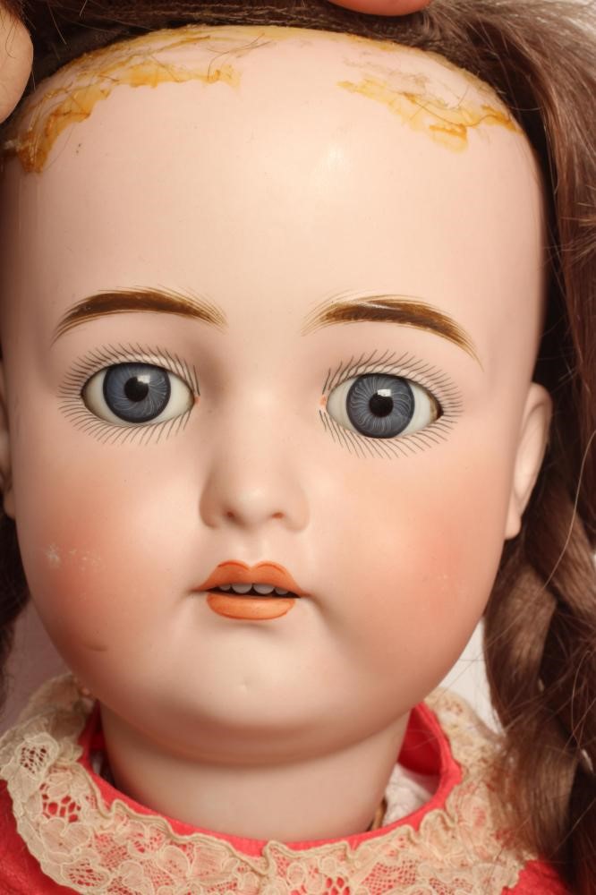 A large German bisque socket head doll Image