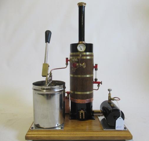 Vertical gas fired boiler with water feed pump, pressure gauge, water gauge and safety valve on Image