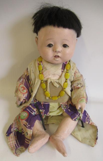 Five Japanese dolls, all with composition heads, fixed eyes and national dress (Est. plus 24% Image