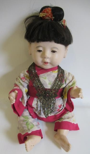 Five Japanese dolls, all with composition heads, fixed eyes and national dress (Est. plus 24% Image