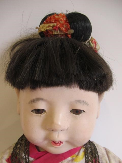 Five Japanese dolls, all with composition heads, fixed eyes and national dress (Est. plus 24% Image