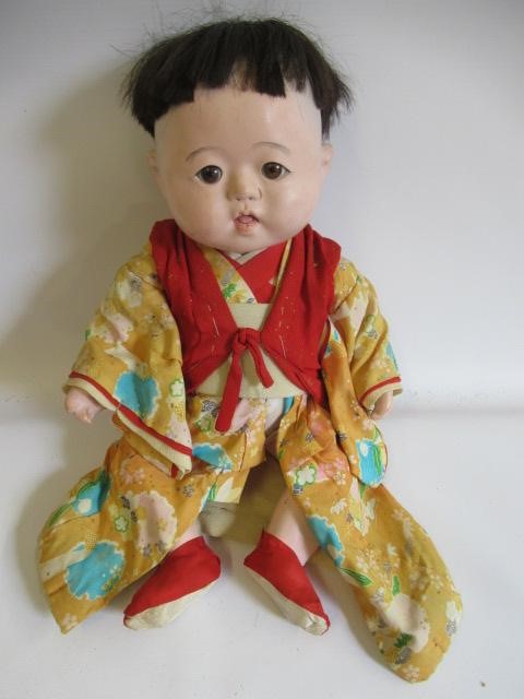 Five Japanese dolls, all with composition heads, fixed eyes and national dress (Est. plus 24% Image