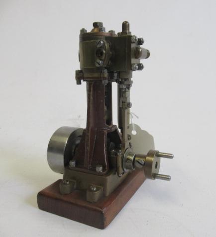 A single cylinder non-reversing vertical steam engine with maker's plate Morss London to cylinder Image