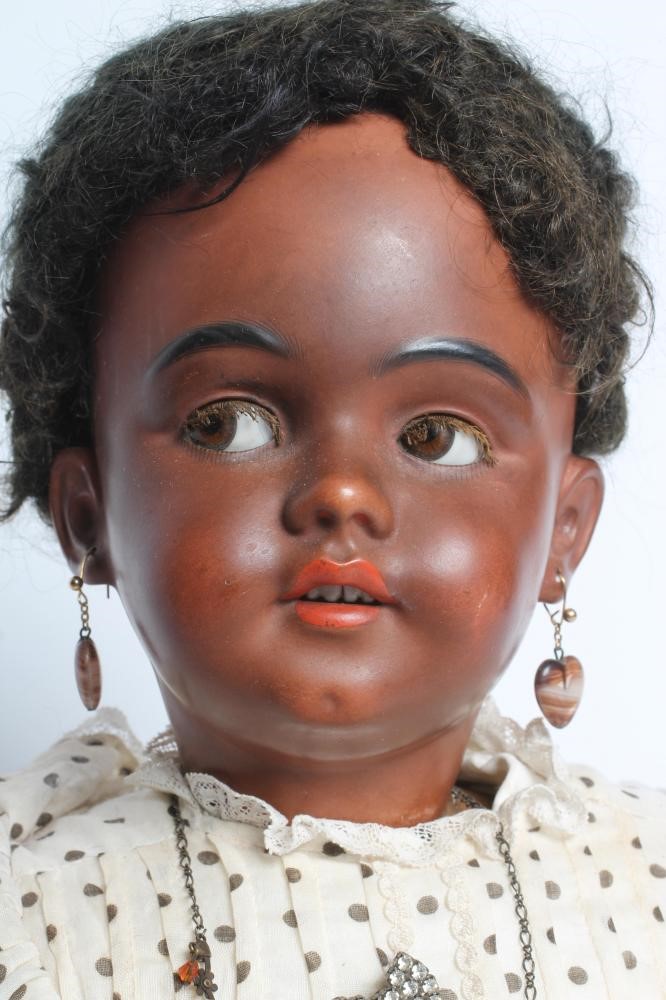 A Simon & Halbig bisque socket head flirty doll Image