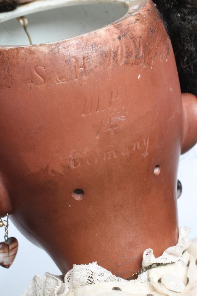 A Simon & Halbig bisque socket head flirty doll Image