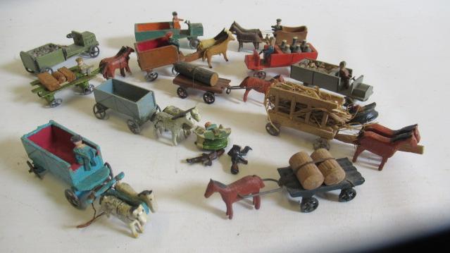 Small German made wooden farm figures by Erzgebirge including horse drawn carts, drivers and motor Image