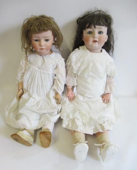 Two restored Gebruder Heubach bisque socket head dolls Image