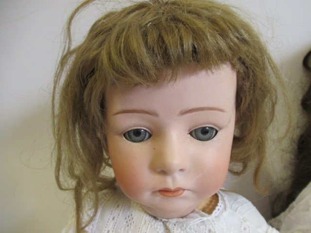 Two restored Gebruder Heubach bisque socket head dolls Image