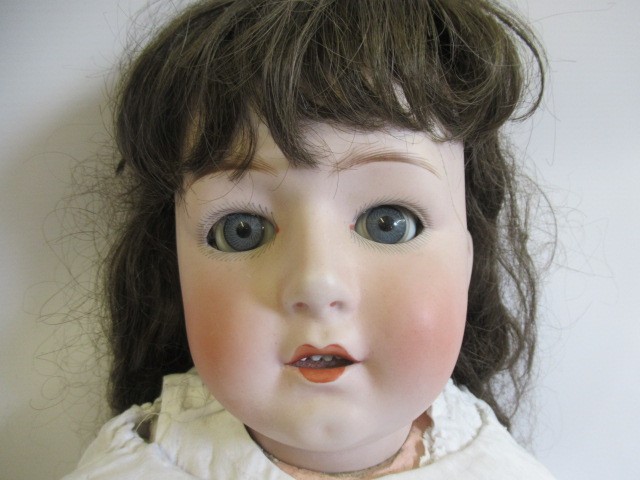 Two restored Gebruder Heubach bisque socket head dolls Image