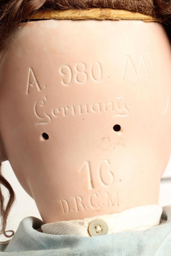 A clockwork Armand Marseille bisque head character doll Image