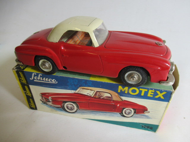 Schuco 1088 Mercedes 195L with friction wiring motor finished in red/cream, box G, model G-E (Est. Image