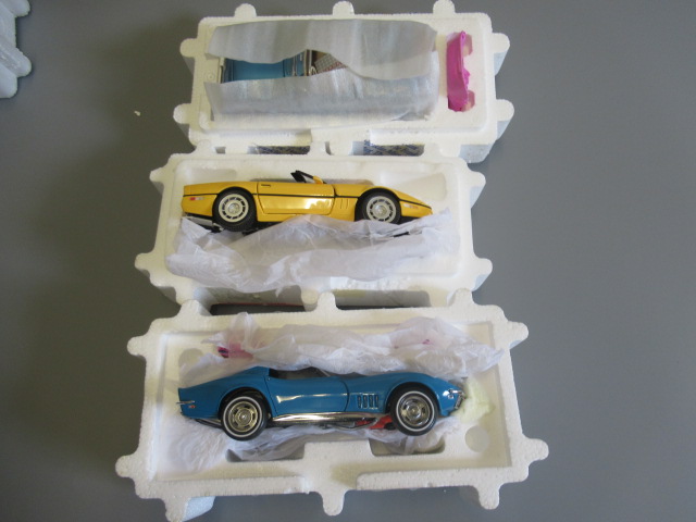 Franklin Mint 1955 Corvette, 1986 Corvette, 1968 Corvette and wooden Corvette display stand (Est. Image