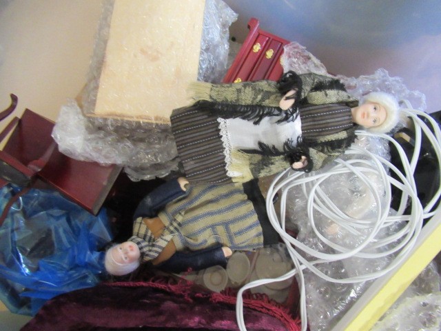 A box of dolls house furniture, including mainly wooden furniture, two dolls and a small box of shop Image
