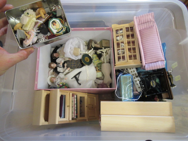 A box of dolls house furniture, including wooden furniture, two metal and wood construction sewing Image