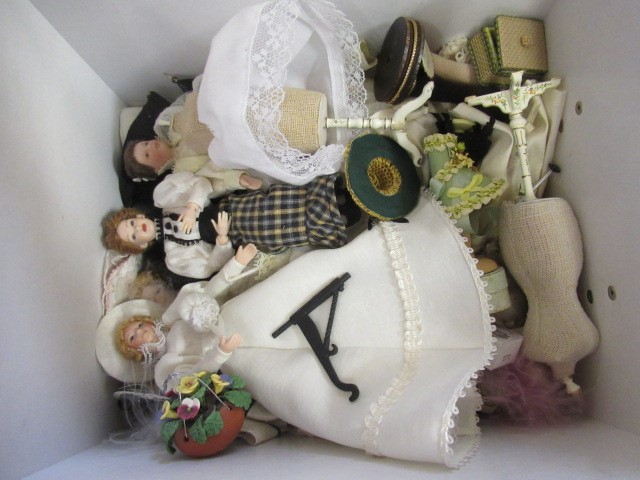 A box of dolls house furniture, including wooden furniture, two metal and wood construction sewing Image