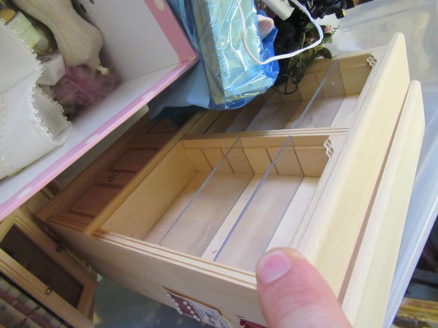 A box of dolls house furniture, including wooden furniture, two metal and wood construction sewing Image