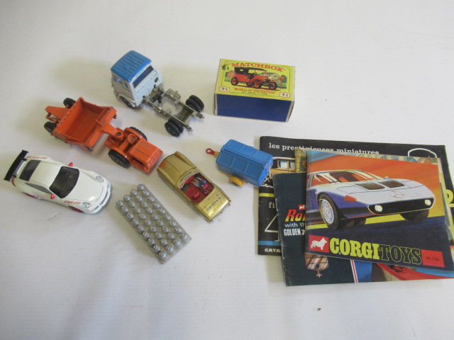 Unboxed diecast vehicles including Corgi trailer, Dinky Spitfire, Matchbox Scraper, a boxed Image