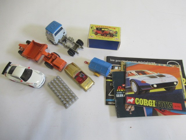 Unboxed diecast vehicles including Corgi trailer, Dinky Spitfire, Matchbox Scraper, a boxed Image