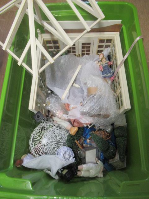 A box of dolls house dolls and outside accessories, including a conservatory, wire work pagoda and Image