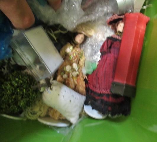 A box of dolls house dolls and outside accessories, including a conservatory, wire work pagoda and Image