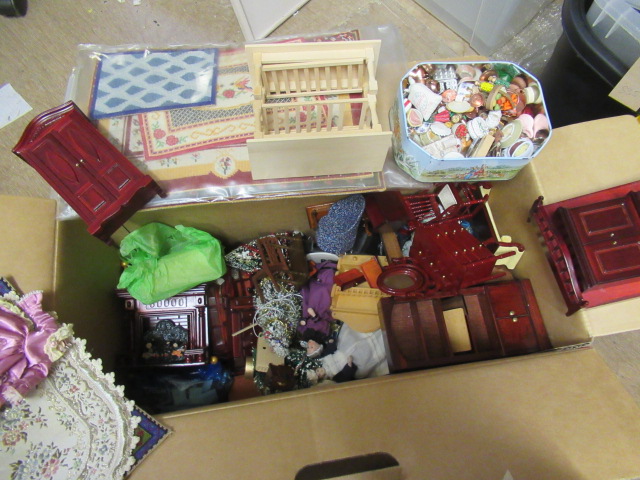 A large box of dolls house furniture and accessories, including mainly wooden furniture, a metal Image