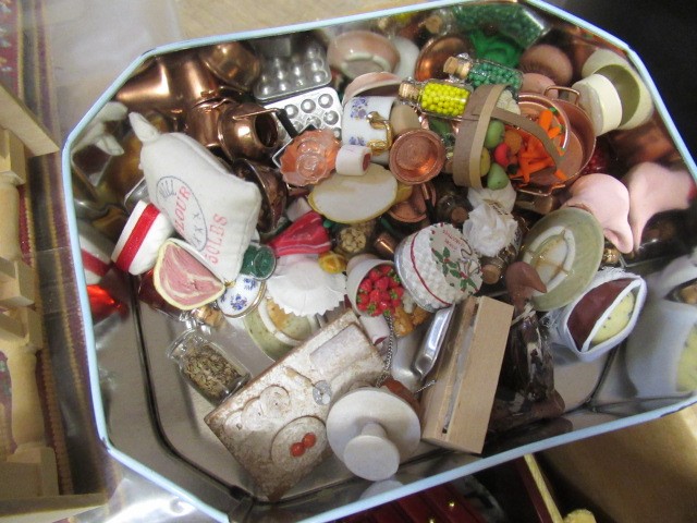 A large box of dolls house furniture and accessories, including mainly wooden furniture, a metal Image